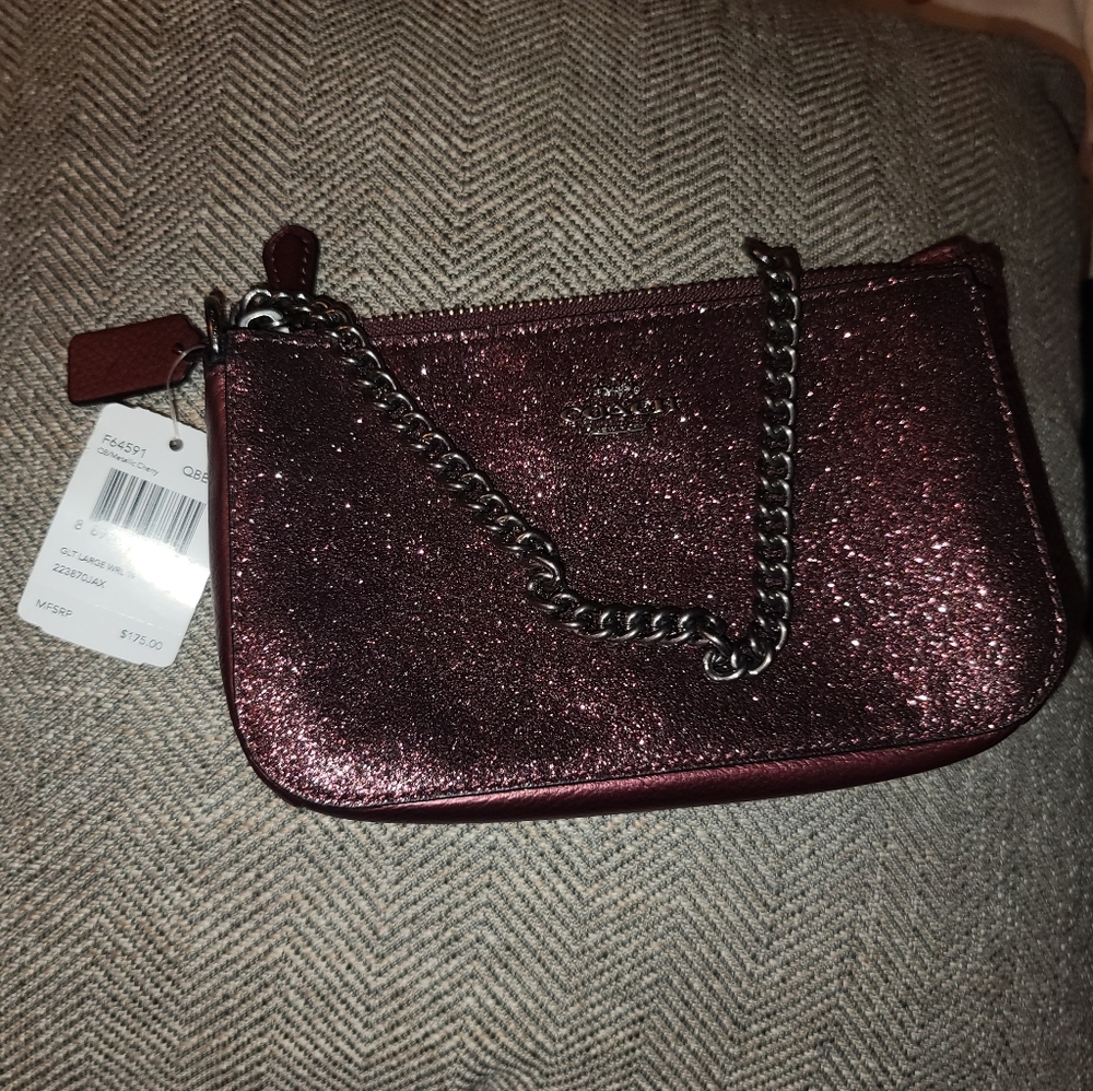Shiny brownish/burnt reddish clutch/wrist purse
